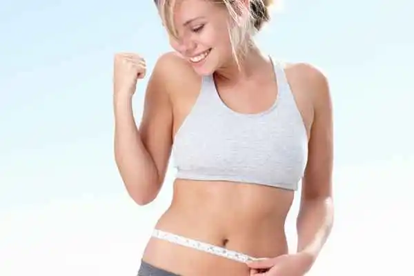 woman happy after fat reduction treatment Stratford-upon-Avon